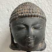 Stone head of a Jina | 13th Century | Gujarat